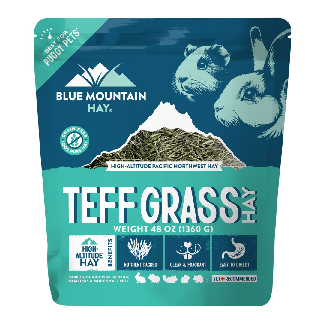 Blue Mountain Hay Teff Grass Hay package with mountain and animal illustrations on a blue background