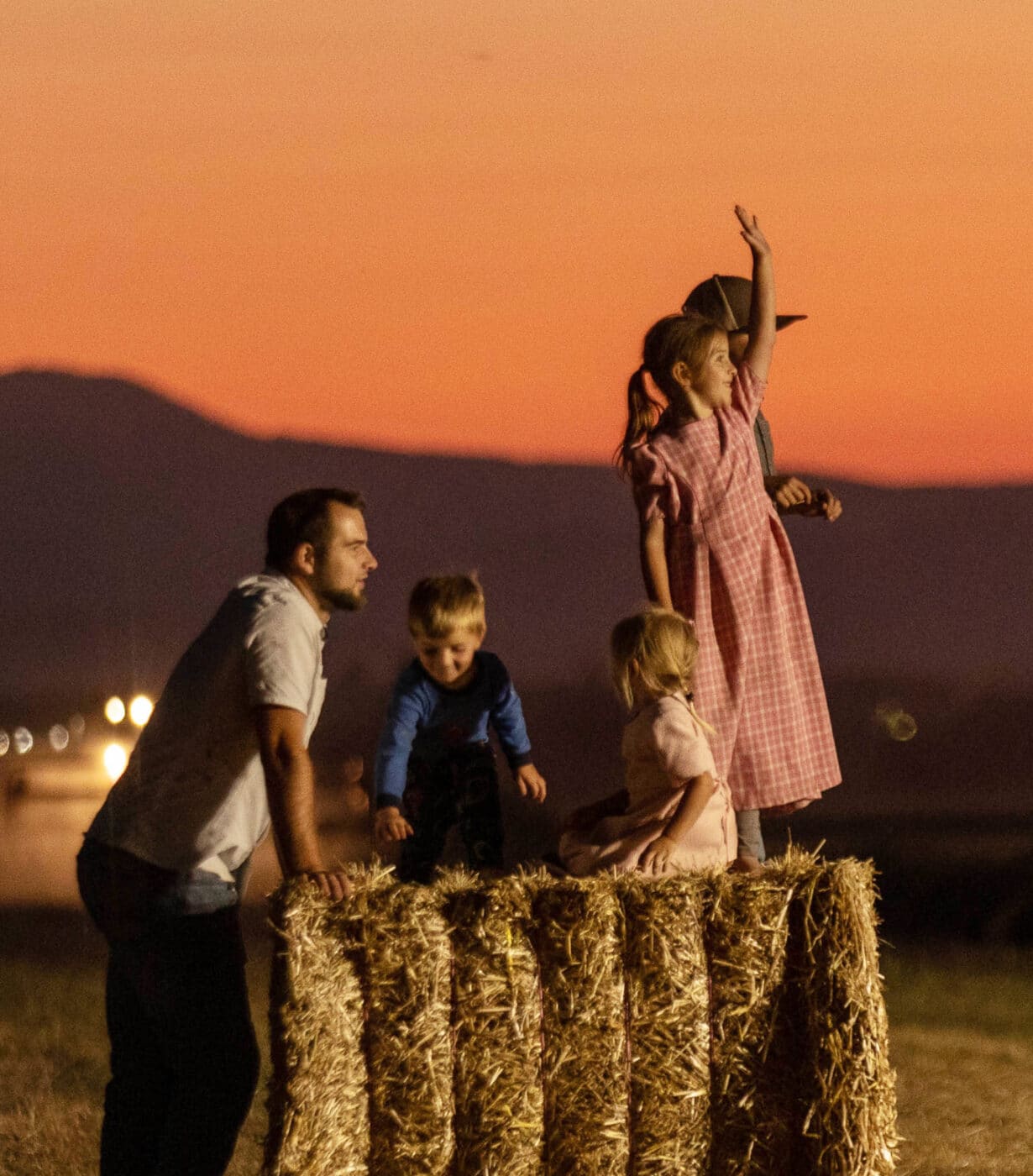 Family on hay bales